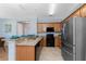 Modern kitchen with granite countertops, stainless steel appliances, and ample cabinetry at 8883 Tuscany Isles Dr, Punta Gorda, FL 33950