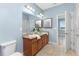 Double vanity bathroom with granite countertop and tiled floors at 8883 Tuscany Isles Dr, Punta Gorda, FL 33950