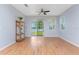 Light and airy living room with hardwood floors and sliding glass doors to patio at 8883 Tuscany Isles Dr, Punta Gorda, FL 33950