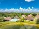 Aerial view of a villa community with pool and lake at 8883 Tuscany Isles Dr, Punta Gorda, FL 33950