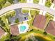 Aerial view of a villa community near a lake at 8883 Tuscany Isles Dr, Punta Gorda, FL 33950