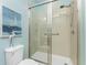 Clean bathroom with a walk-in shower and tiled floors at 8883 Tuscany Isles Dr, Punta Gorda, FL 33950