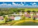Aerial view of a villa community near a lake at 8883 Tuscany Isles Dr, Punta Gorda, FL 33950