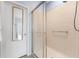Walk-in shower with glass enclosure and grab bar at 8883 Tuscany Isles Dr, Punta Gorda, FL 33950