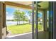 Covered patio overlooking lake, pool, and community clubhouse at 8883 Tuscany Isles Dr, Punta Gorda, FL 33950