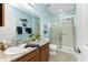 Bathroom with a single vanity, tiled shower, and granite countertop at 8883 Tuscany Isles Dr, Punta Gorda, FL 33950
