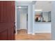 Bright entryway with light hardwood floors and an open view to the kitchen at 8883 Tuscany Isles Dr, Punta Gorda, FL 33950