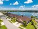 Aerial view of a villa community with a lake at 8883 Tuscany Isles Dr, Punta Gorda, FL 33950