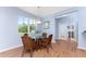 Bright dining area with hardwood floors and French doors leading to another room at 8883 Tuscany Isles Dr, Punta Gorda, FL 33950