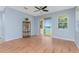 Light and airy living room with hardwood floors and sliding glass doors to patio at 8883 Tuscany Isles Dr, Punta Gorda, FL 33950