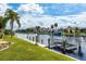 Scenic waterfront view featuring a private dock and boat lift on a beautiful canal at 2807 Via Paloma Dr, Punta Gorda, FL 33950