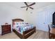 Charming bedroom with floral bedding and wood floors at 85 Vivante Blvd # 8524, Punta Gorda, FL 33950