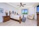 Bright bedroom with wood furniture and relaxing sitting area at 85 Vivante Blvd # 8524, Punta Gorda, FL 33950