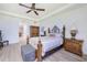 Spacious bedroom with wood flooring and a large bed at 85 Vivante Blvd # 8524, Punta Gorda, FL 33950