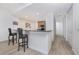 Kitchen with granite countertops, wood cabinets and breakfast bar at 85 Vivante Blvd # 8524, Punta Gorda, FL 33950