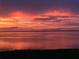 Stunning sunset over calm water, offering serene waterfront views at 85 Vivante Blvd # 8524, Punta Gorda, FL 33950