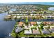 Aerial view of waterfront property, showcasing a canal-front home and surrounding neighborhood at 2807 Via Paloma Dr, Punta Gorda, FL 33950