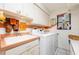Laundry room with washer, dryer, and storage at 2807 Via Paloma Dr, Punta Gorda, FL 33950