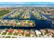 Aerial view of waterfront property with canal access and lush landscaping at 2807 Via Paloma Dr, Punta Gorda, FL 33950