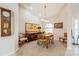 Bright dining room with a formal table setting, large artwork, and natural light at 2807 Via Paloma Dr, Punta Gorda, FL 33950