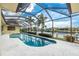 Relaxing pool and patio area with screened enclosure and water views at 2807 Via Paloma Dr, Punta Gorda, FL 33950