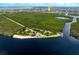Aerial view showing waterfront property near a park and beach access at 2807 Via Paloma Dr, Punta Gorda, FL 33950