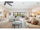 Living room with vaulted ceilings, neutral decor, and access to the pool at 2807 Via Paloma Dr, Punta Gorda, FL 33950