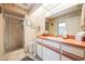 Bathroom with shower, vanity, and tiled floors at 2807 Via Paloma Dr, Punta Gorda, FL 33950