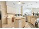 Spacious kitchen with an island and views to the Gathering room and pool area at 2807 Via Paloma Dr, Punta Gorda, FL 33950