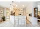 Bright kitchen with an island, white cabinets, and stainless steel appliances at 2807 Via Paloma Dr, Punta Gorda, FL 33950