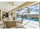 Relaxing pool area with screened enclosure and canal views at 2807 Via Paloma Dr, Punta Gorda, FL 33950