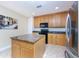 Well-equipped kitchen featuring granite island and ample cabinetry at 85 Vivante Blvd # 8524, Punta Gorda, FL 33950