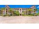 Exterior view of Mediterranean style building with landscaping at 85 Vivante Blvd # 8524, Punta Gorda, FL 33950