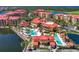 Aerial view of community with pools and tennis courts at 85 Vivante Blvd # 8524, Punta Gorda, FL 33950