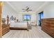 Main bedroom with plush carpeting, king-size bed, and water views at 85 Vivante Blvd # 8524, Punta Gorda, FL 33950