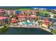 Aerial view of community with pool, tennis courts and waterfront at 85 Vivante Blvd # 8524, Punta Gorda, FL 33950