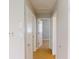 Hallway with neutral walls and tile floors at 8724 Agress Ave, North Port, FL 34287