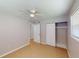 Bright bedroom with ceiling fan and spacious closet at 8724 Agress Ave, North Port, FL 34287