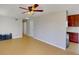 Spacious living room with tile floors and ceiling fan at 8724 Agress Ave, North Port, FL 34287