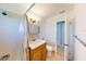 Bathroom with shower, vanity, and toilet at 8724 Agress Ave, North Port, FL 34287