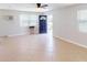 Bright living room with tile floors and ceiling fan at 8724 Agress Ave, North Port, FL 34287
