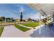Neatly landscaped lawn with a view of a quiet residential street at 8724 Agress Ave, North Port, FL 34287