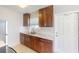 Updated kitchen with wood cabinets and marble countertops at 8724 Agress Ave, North Port, FL 34287