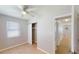 Well-lit bedroom with closet and access to hallway at 8724 Agress Ave, North Port, FL 34287