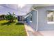 Side view of house with walkway and backyard at 8724 Agress Ave, North Port, FL 34287