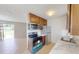 Modern kitchen with stainless steel appliances and wood cabinets at 8724 Agress Ave, North Port, FL 34287