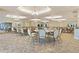 Large ballroom perfect for events with multiple tables and chairs at 2555 Brassica Dr, North Port, FL 34289