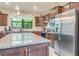 Modern kitchen with granite countertops and stainless steel appliances at 2555 Brassica Dr, North Port, FL 34289