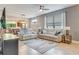 Open concept living room with view into kitchen and dining area at 2555 Brassica Dr, North Port, FL 34289