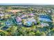 Aerial view of community with pool, tennis courts, and clubhouse at 2555 Brassica Dr, North Port, FL 34289